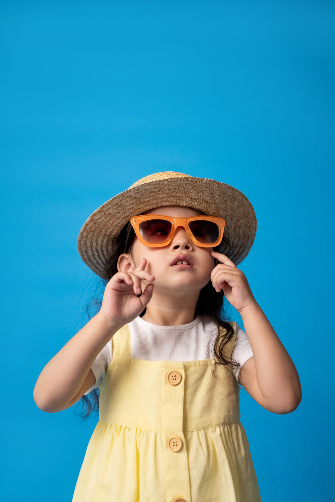 Woman in White Button Up Shirt Wearing Brown Sun Hat and Sunglasses